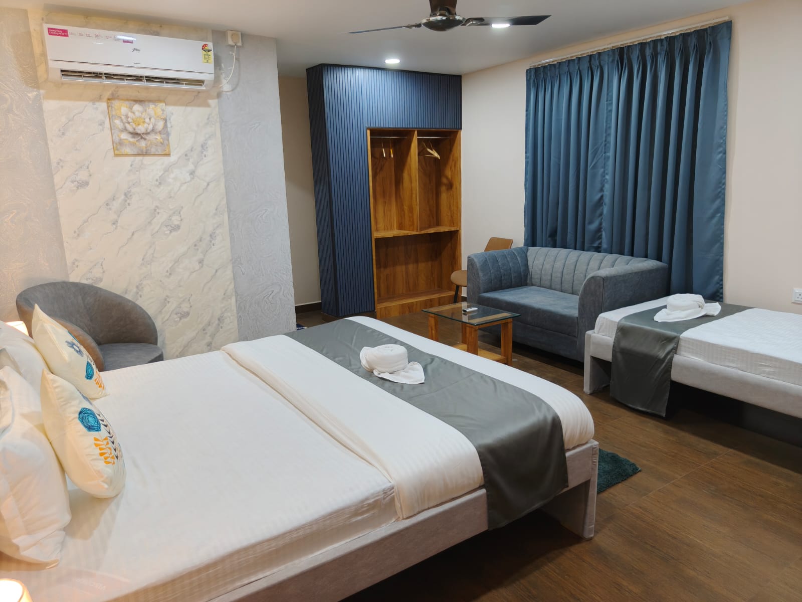 Spacious room with seating at Majestic Inn
